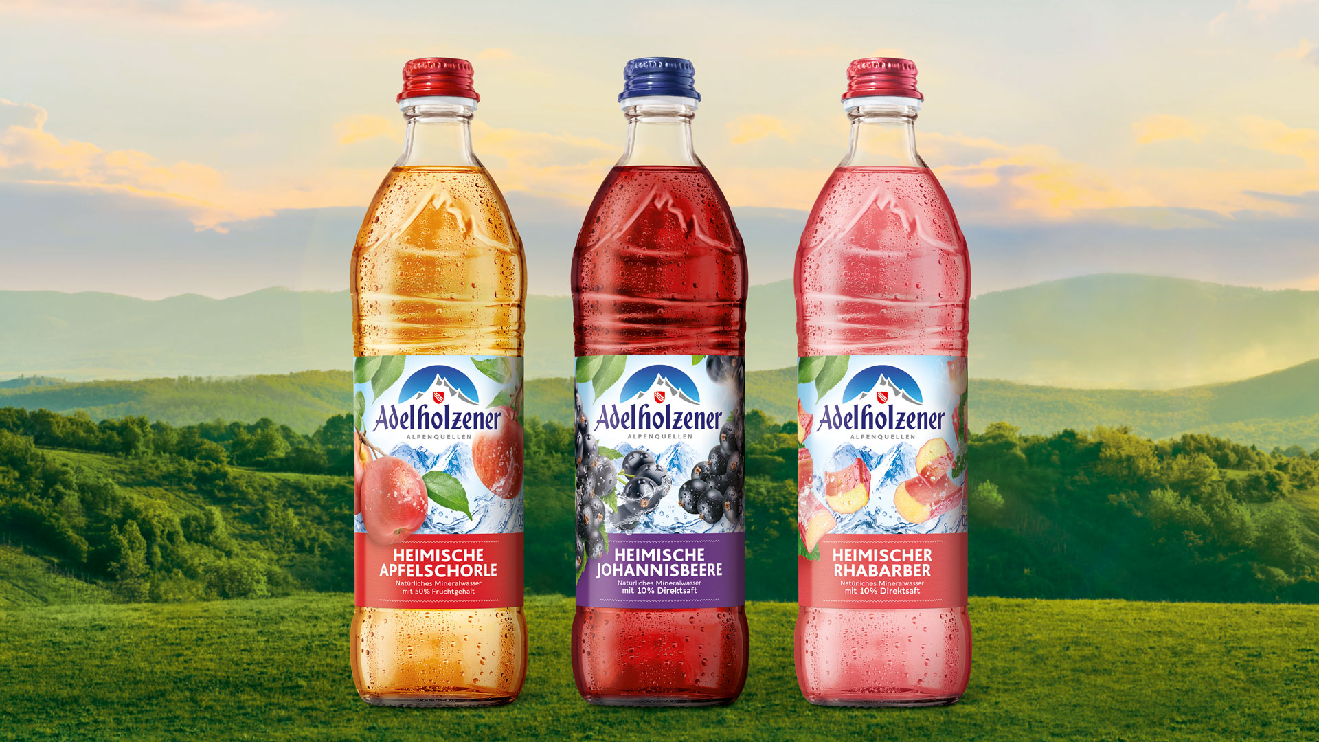 Verpackungsdesign der Adelholzener Heimische Sorten von Hajok Design – PET-Flaschen mit transparentem Etikett in drei Fruchtsorten