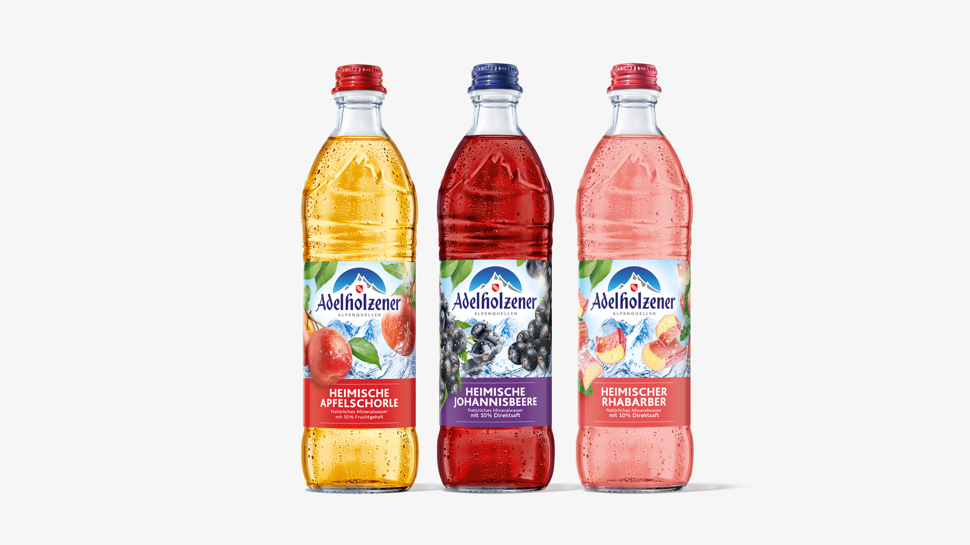 Packshots der Adelholzener Heimische Apfelschorle, Heimische Johannisbeere und Heimischer Rhabarber