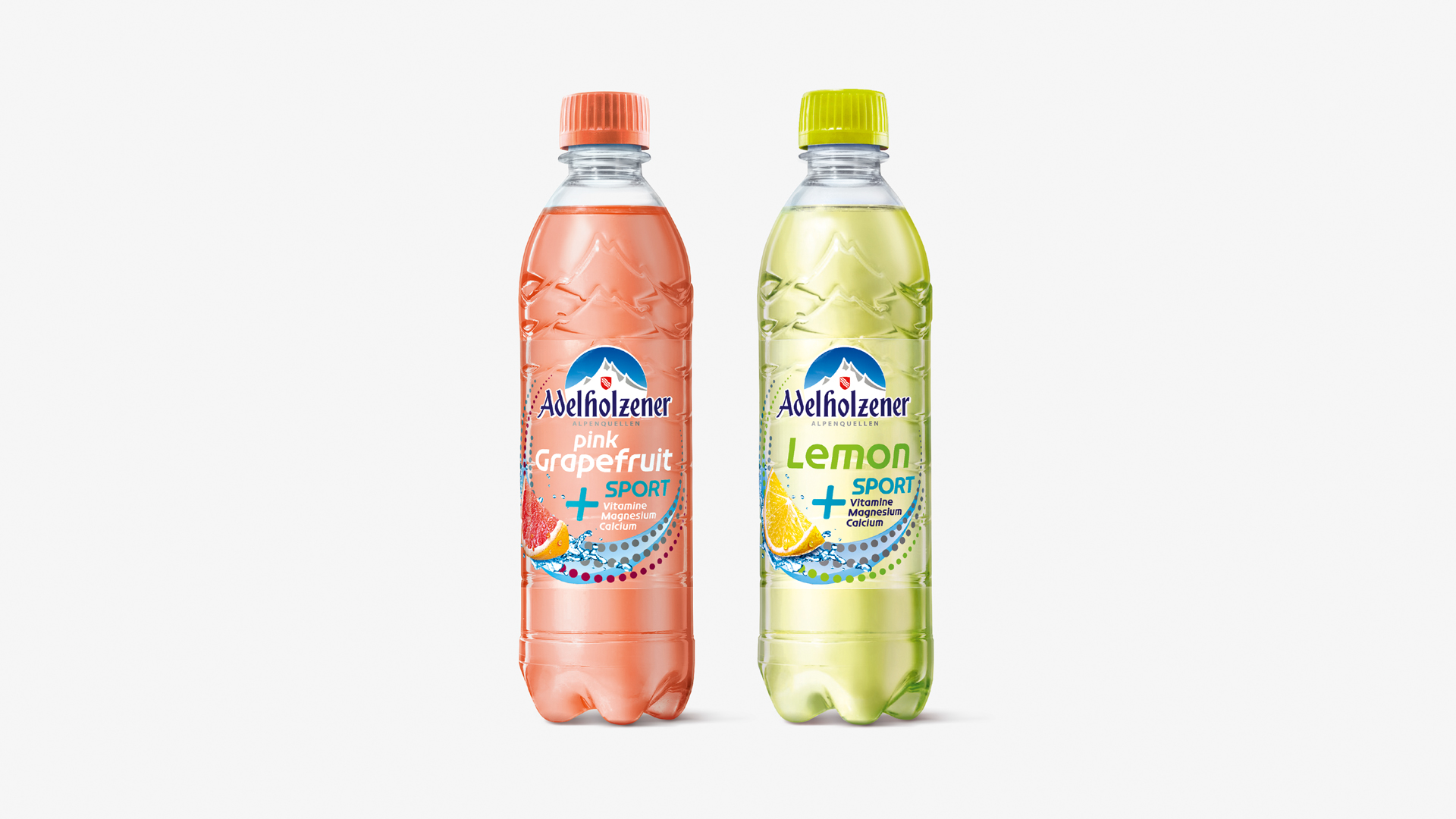 Zwei Flaschen Adelholzener Sport mit Etiketten im alten Design, Sorten Pink Grapefruit und Lemon