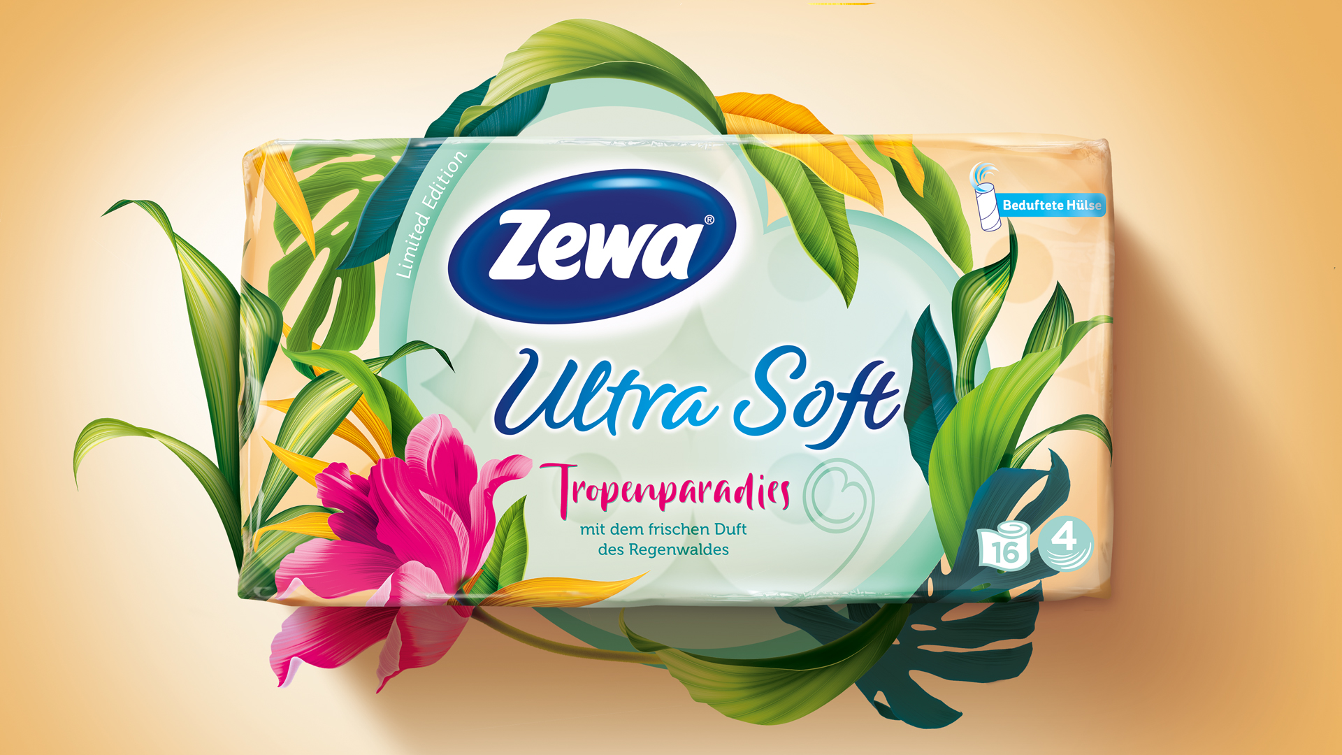 Zewa Ultra Soft Limited Edition ‚Tropenparadies‘: Verpackung in sonnigen Cremetönen, umrahmt von exotischen Blättern und einer pinken Tropenblüte – mit dem Claim ‚mit dem frischen Duft des Regenwaldes‘, visuell inszeniert als sommerlich-frische Dschungelfantasie.